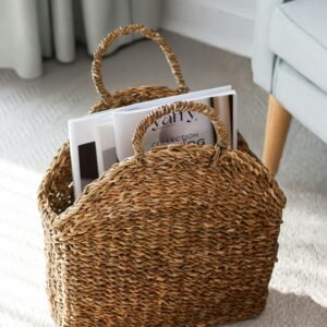 Rustic woven basket holding magazines, lit by soft indoor lighting.